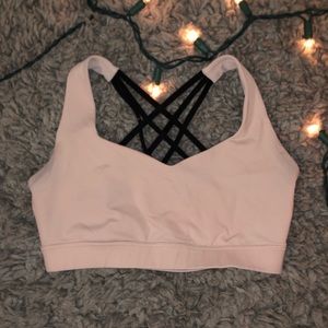 Strappy pale salmon/pink colored sports bra
